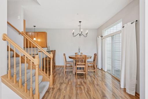 Informal dining walks out to private patio. Stylish modern fixtures.