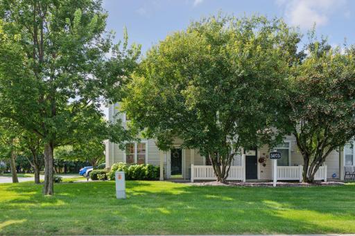 Patio with mature trees and easy access to grassy area.