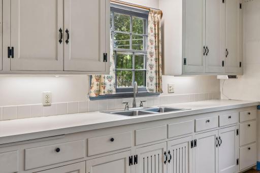 Kitchen window provides views to the back patio and gardens.