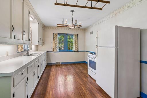 Spacious kitchen with room for small table and chairs.