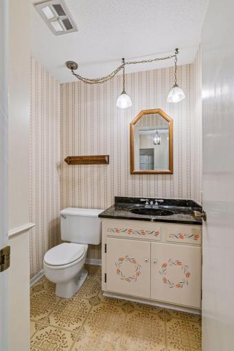 Cute half-bath on the first floor near the den area.