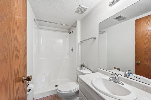 The lower-level bathroom adds convenience to the home's thoughtful floor plan.