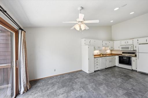 The kitchen is designed for everyday functionality with updated flooring and convenient workspace.