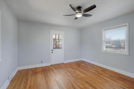 Upper level bedroom with access to upper level surround deck.