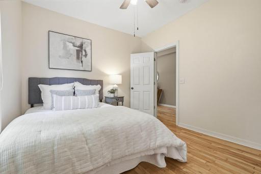 Comfortable bedroom retreat with neutral finishes and generous closet space.