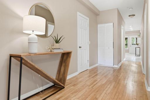 Gorgeous hardwood floors connecting living spaces with thoughtful storage options.