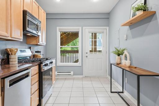 Bright kitchen offering direct access to outdoor living areas.