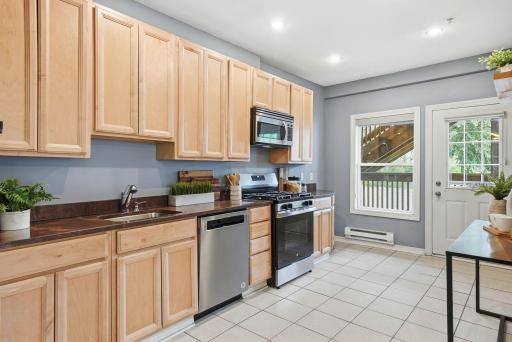 Stainless steel appliance package and plenty of countertop workspace.