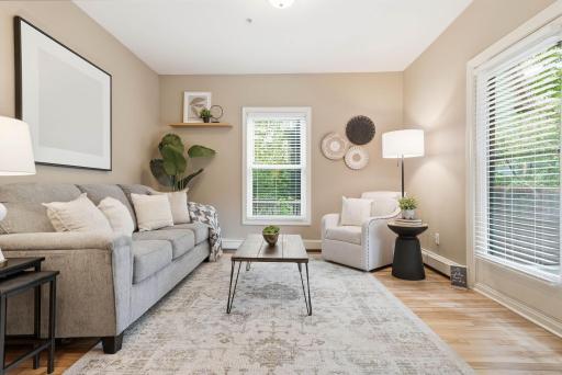 Spacious living room with abundant natural light and inviting gathering spaces.