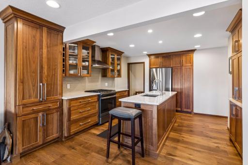 18018 Judicial Way N has the most beautiful kitchen. It is a stunner that was remodeled in February 2018 with custom cabinetry, countertops, stainless steel appliances, updated flooring, and added insulation along the shared kitchen wall.