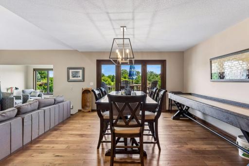 Check out the views from your new dining area. This entire floor is boasted with natural lighting that enhances the entirety of the space. You are overlooking Brackett's Golf Course.