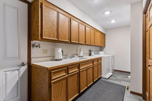 Laundry room is on the main level which is very convenient. In here there is also storage possibility with all of the cabinet space.