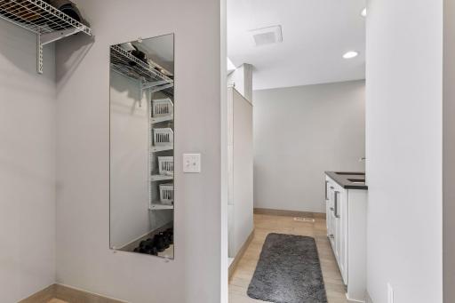 A glimpse of the dual walk-in closets. Great spot for storage and organization.
