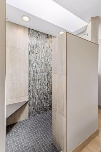 A custom built and tiled walk-in shower. Designed perfectly.