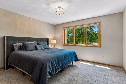 Bedroom #2 on the upper level. A very generous sized bedroom that has nice natural lighting. In 2023 new Renewal by Anderson windows were installed.