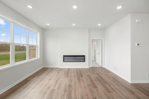 The Family room features a fireplace and LVP flooring!