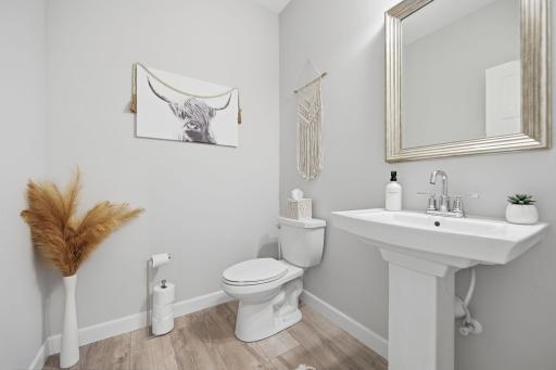 The powder room accommodates all on the main level.