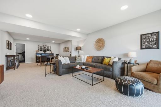 Your finishhed walkout lower level with two additional bedrooms, a bathroom, a gathering room, and an amusement area.