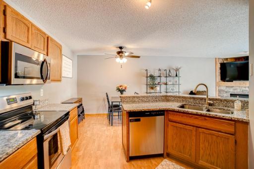 Kitchen with updated quartz countertops, updated sink and faucet