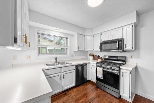 White and bright kitchen with natural lighting adding to the brightness.