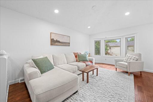 This home is bright and cheery throughout. Living room with recessed lighting. Home interior has been recently painted.