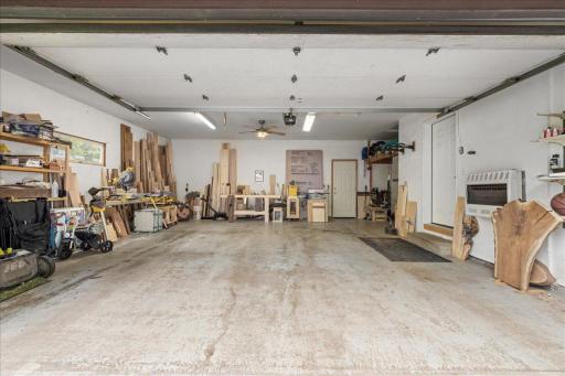 The insulated extended 2-car garage is wired for 220V service, making it ideal for hobbies, projects, or additional functionality.