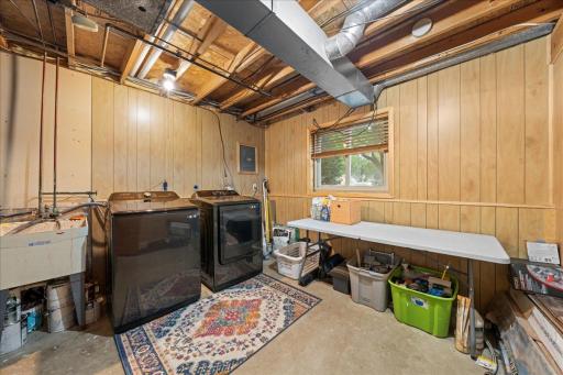Laundry room with utility sink and window to help make chores not so bad.