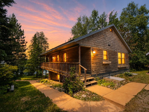 1787 North Bay Rd home outside at dusk.png