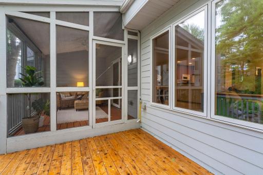 Step from the screened porch out to the deck.