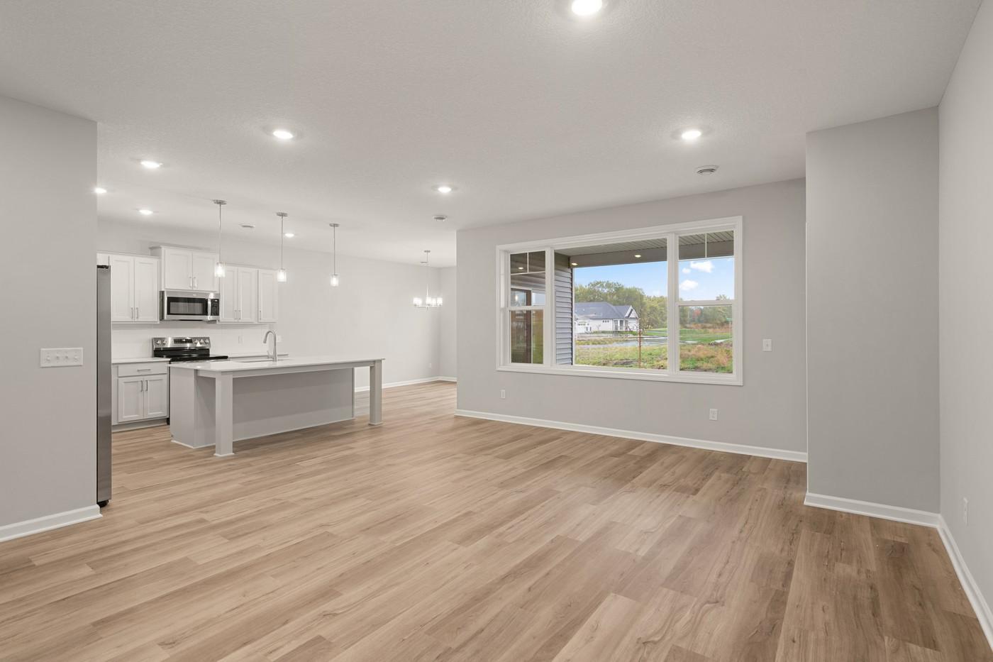 Family room adjacent to kitchen area - Image of the Actual Home