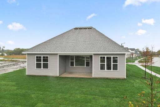 Back exterior of home including cover patio.