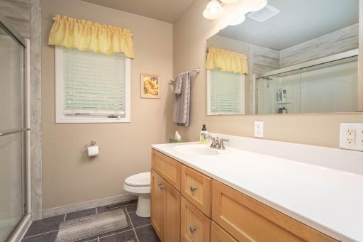 3/4 bath with wonderful tile and fun shiplap touches.