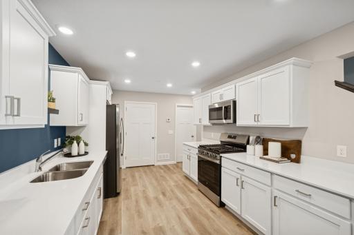 Kitchen - photos of are a staged model home of the same floorplan. Colors and selections may differ.