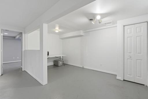 Wall partially removed to add to living space for more functionality. Make it an office or another kitchen area!