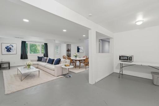 Virtually staged lower level family room.