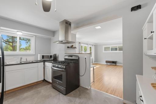 Open views to living room to stay connected with guests.