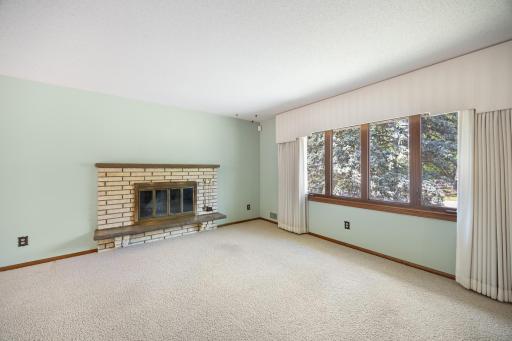 Cozy up to this fireplace in the main living room