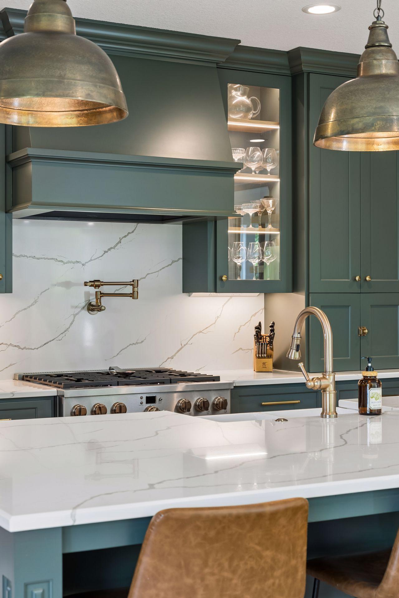Professional-grade appliances, expansive quartz surfaces, and timeless finishes create a kitchen that is equally beautiful and functional.