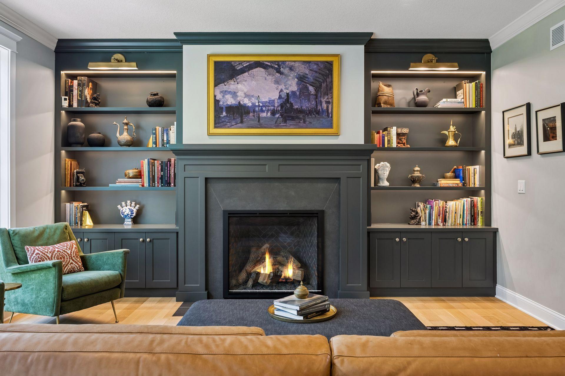 Custom cabinetry, illuminated display shelving, and a floor-to-ceiling fireplace create a stunning focal point for everyday living.
