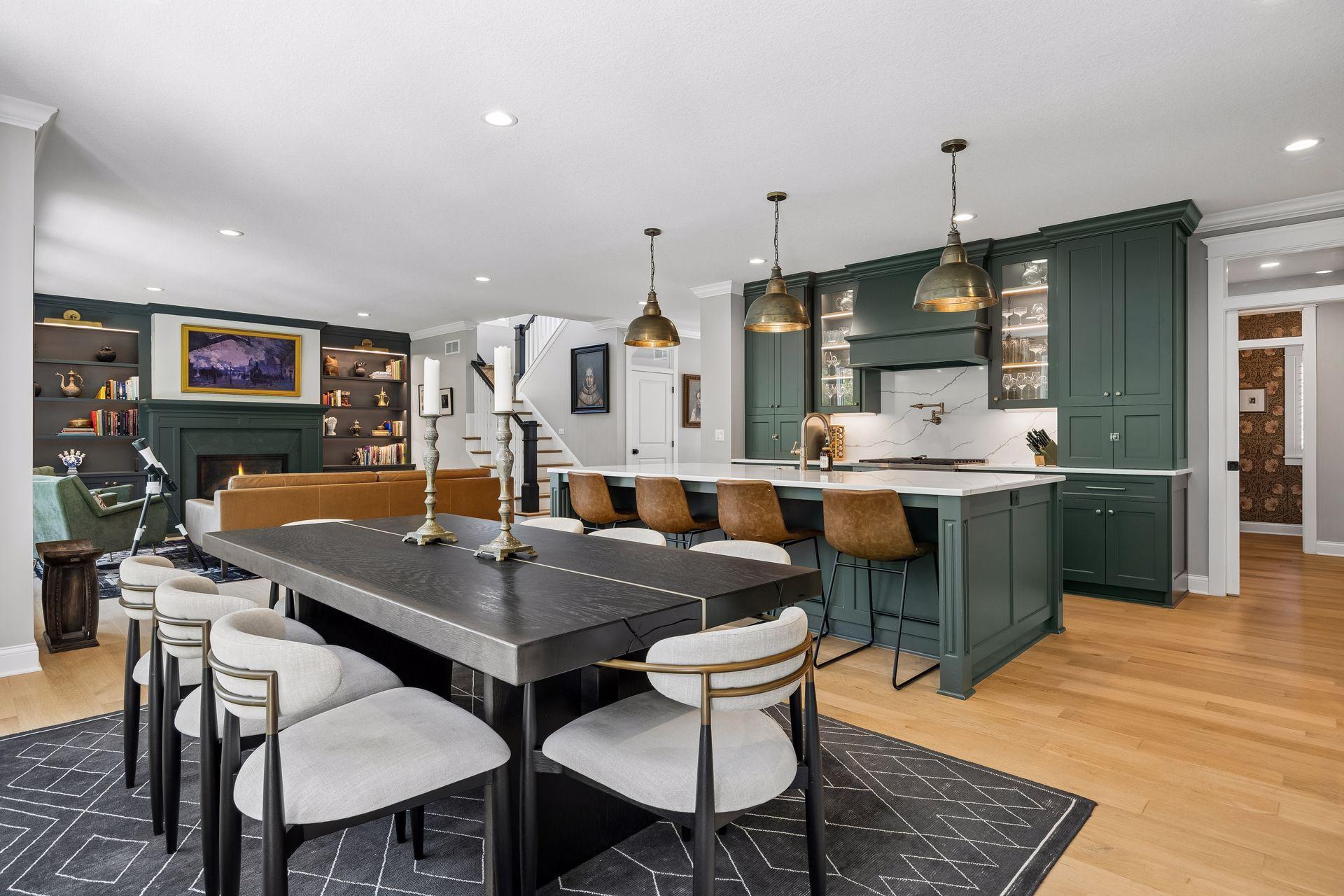 An open-concept design that effortlessly connects cooking, dining, and gathering spaces while maintaining elegant proportions throughout.
