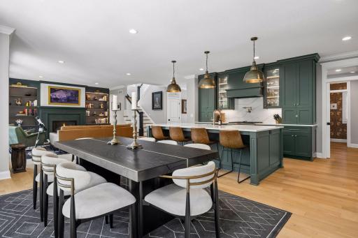 An open-concept design that effortlessly connects cooking, dining, and gathering spaces while maintaining elegant proportions throughout.