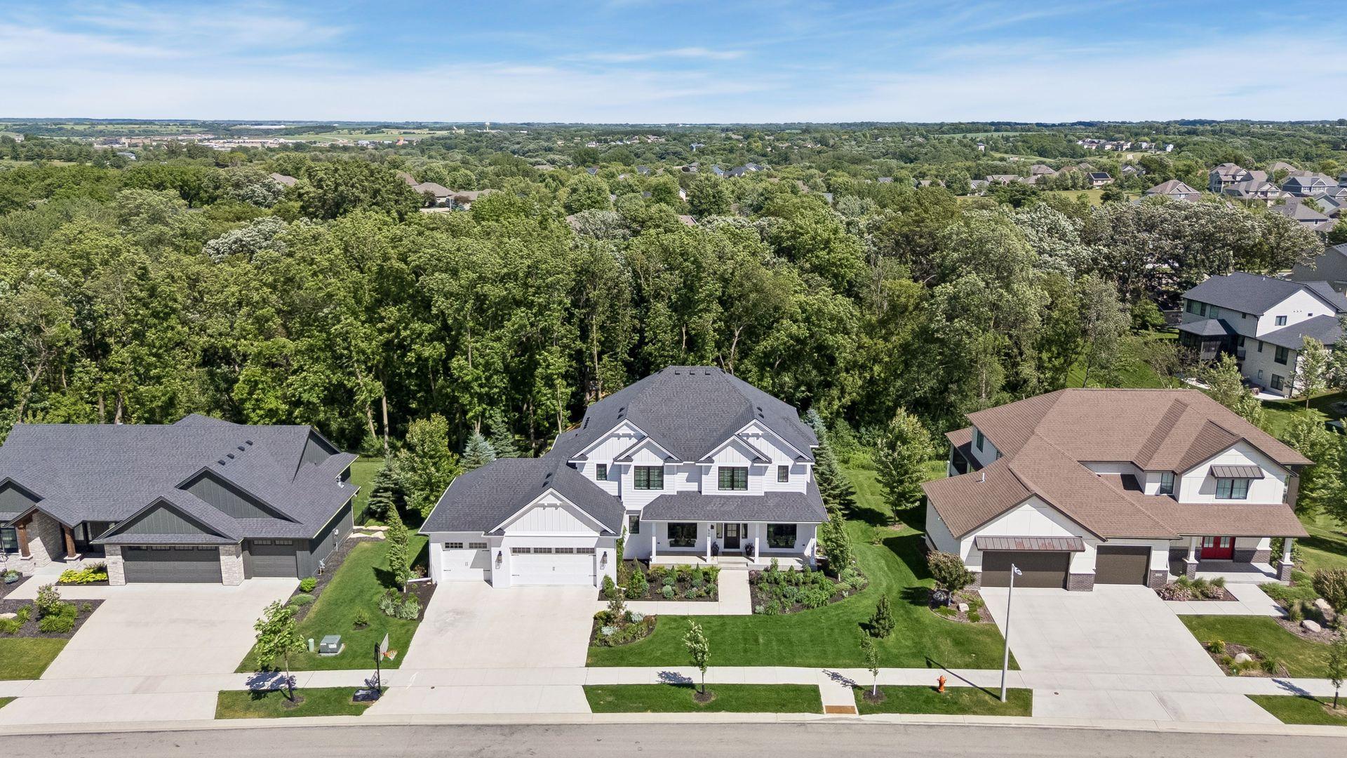 Perfectly positioned on one of Rochester's most coveted wooded homesites, offering exceptional privacy with mature trees as your backyard backdrop.