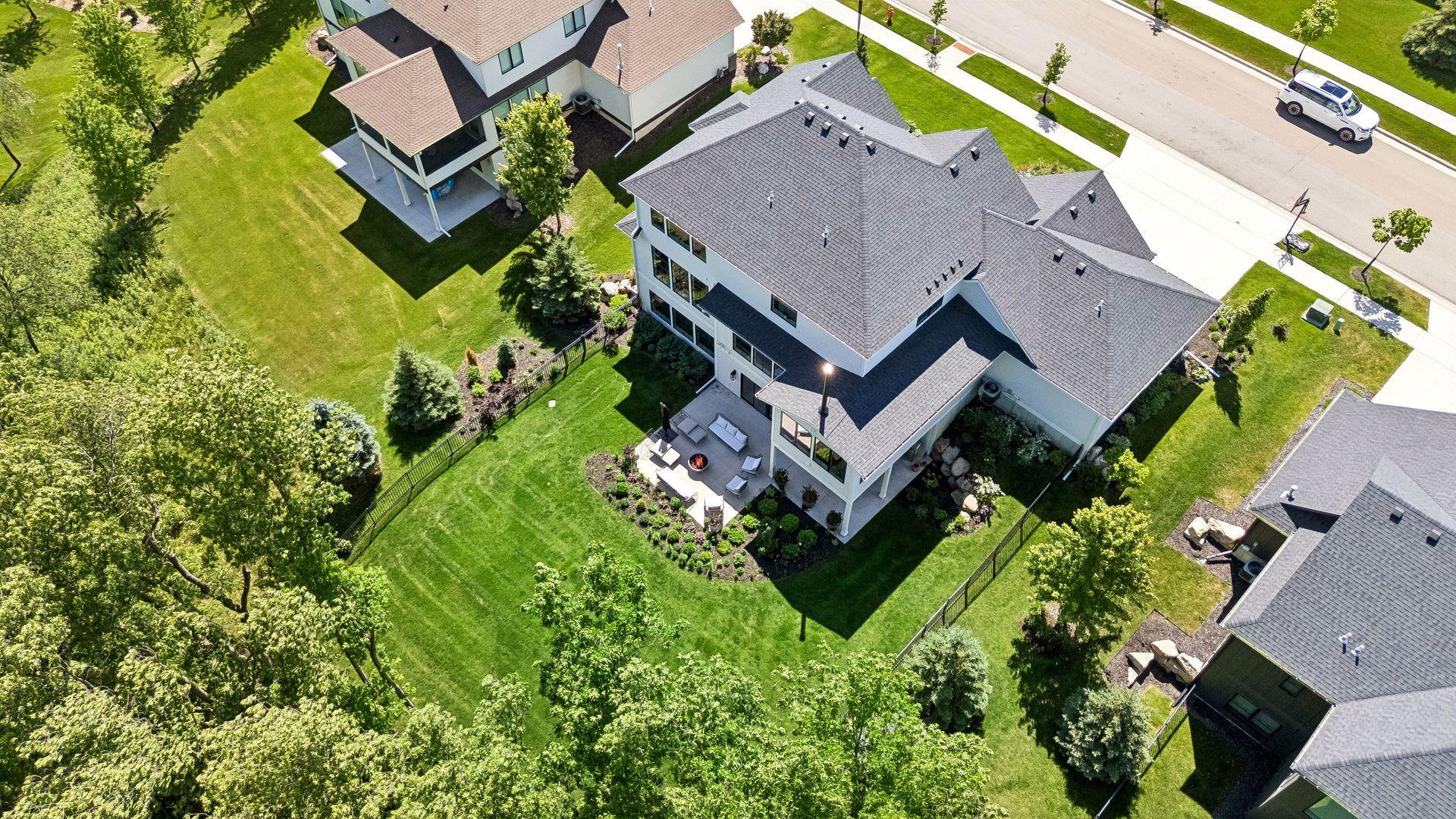Beautifully landscaped outdoor living spaces blend seamlessly into the surrounding trees, creating your own private retreat.