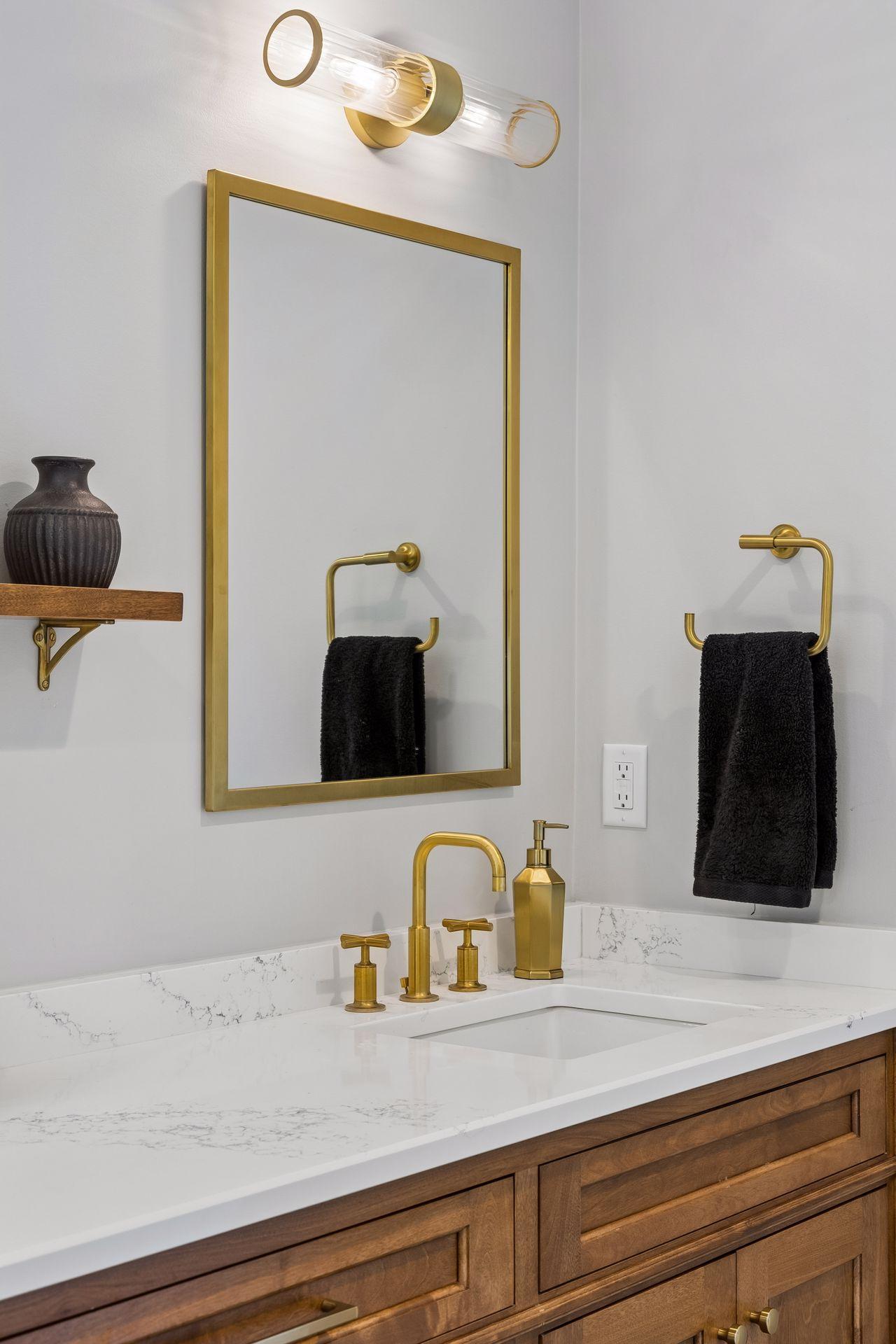 Every finish was intentionally selected—from the warm walnut cabinetry to the sophisticated brushed brass hardware and lighting.