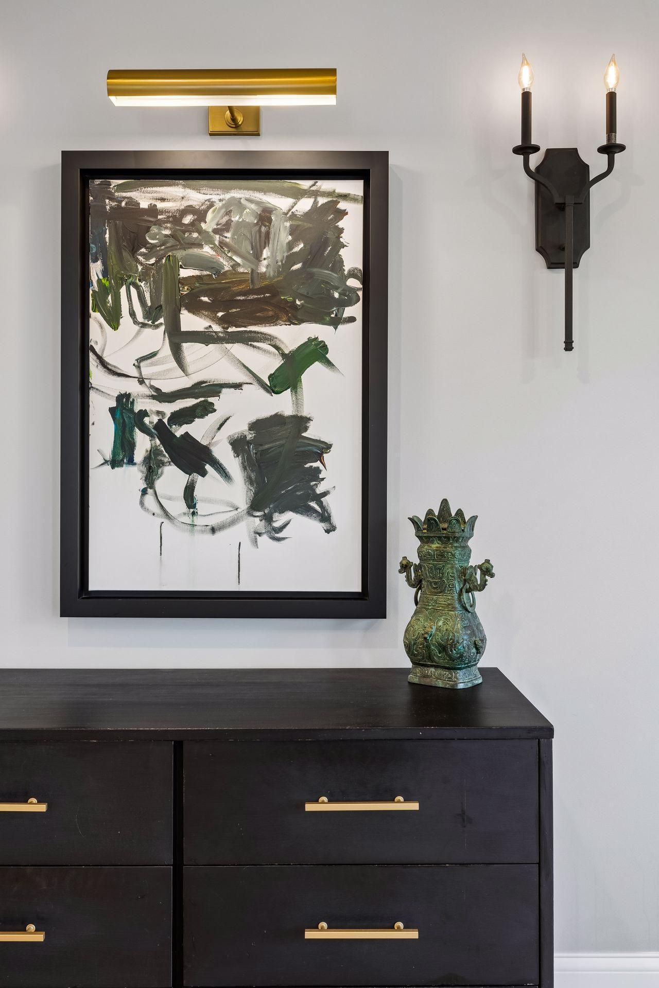 Curated lighting, custom furnishings, and carefully selected artwork reinforce the home's refined aesthetic throughout.
