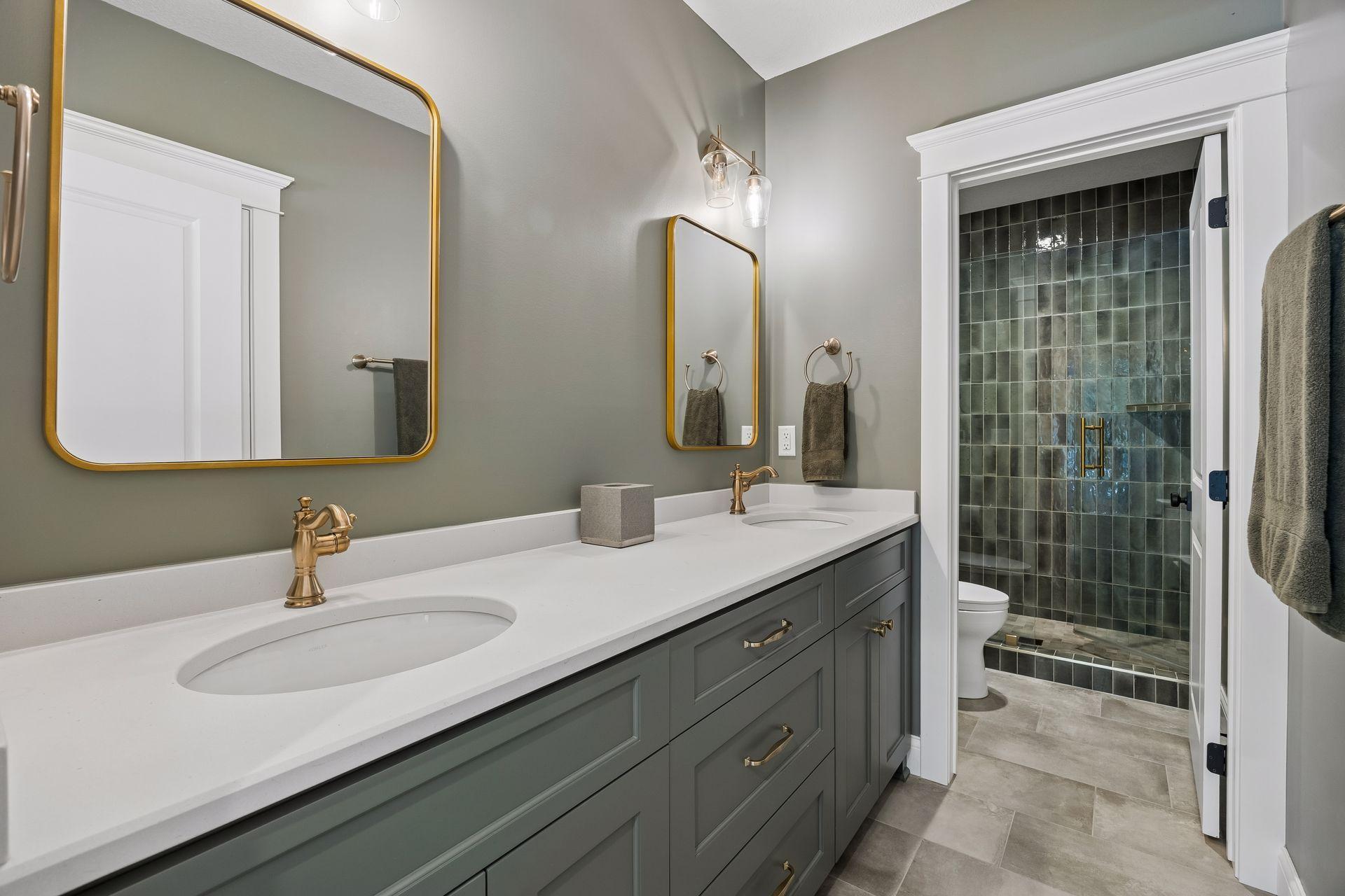 Custom cabinetry, quartz countertops, designer lighting, and elegant finishes create a bathroom that rivals many primary suites.