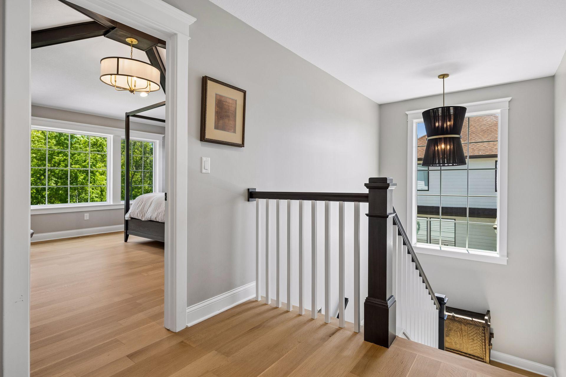 Natural light pours into the second-floor gallery, connecting private spaces with warmth and architectural elegance.