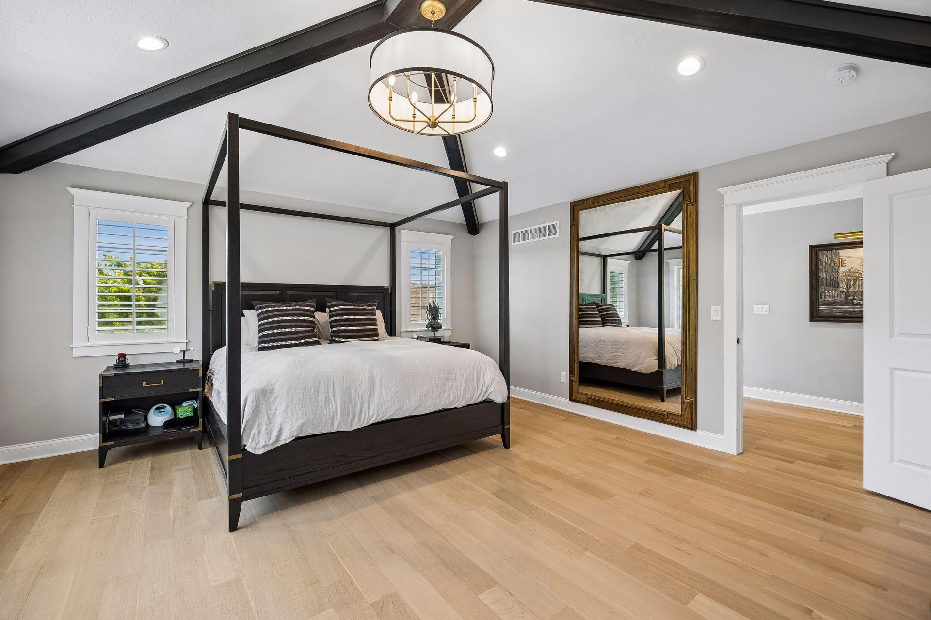 Generous proportions and thoughtful design create a primary suite that feels more like a luxury boutique hotel than a bedroom.