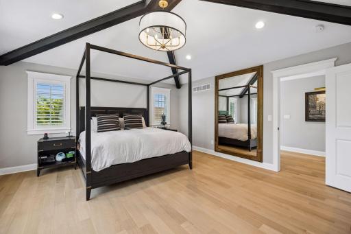 Generous proportions and thoughtful design create a primary suite that feels more like a luxury boutique hotel than a bedroom.