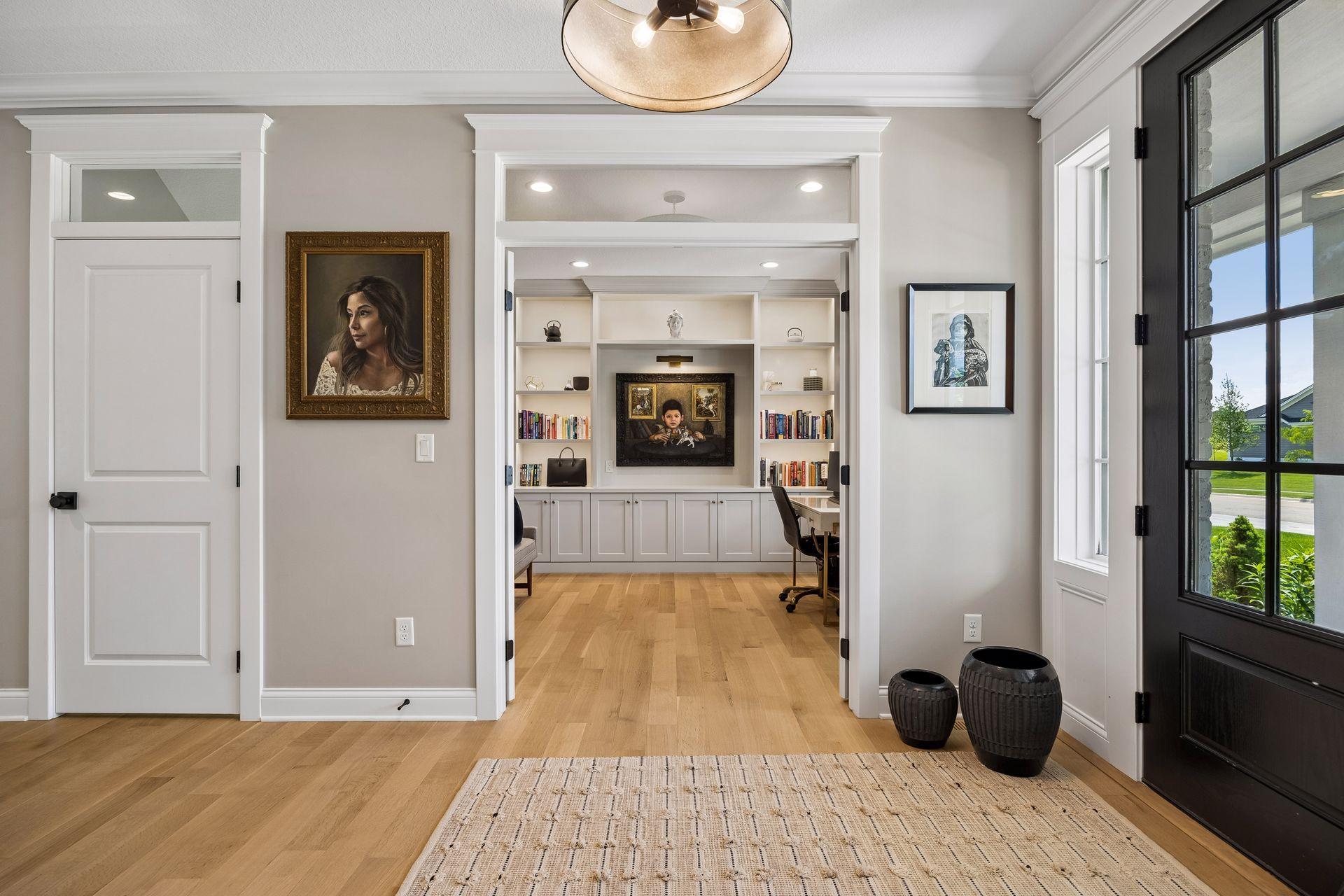 French-style openings connect the formal dining room to the adjacent office while preserving each room's distinct character and elegance.